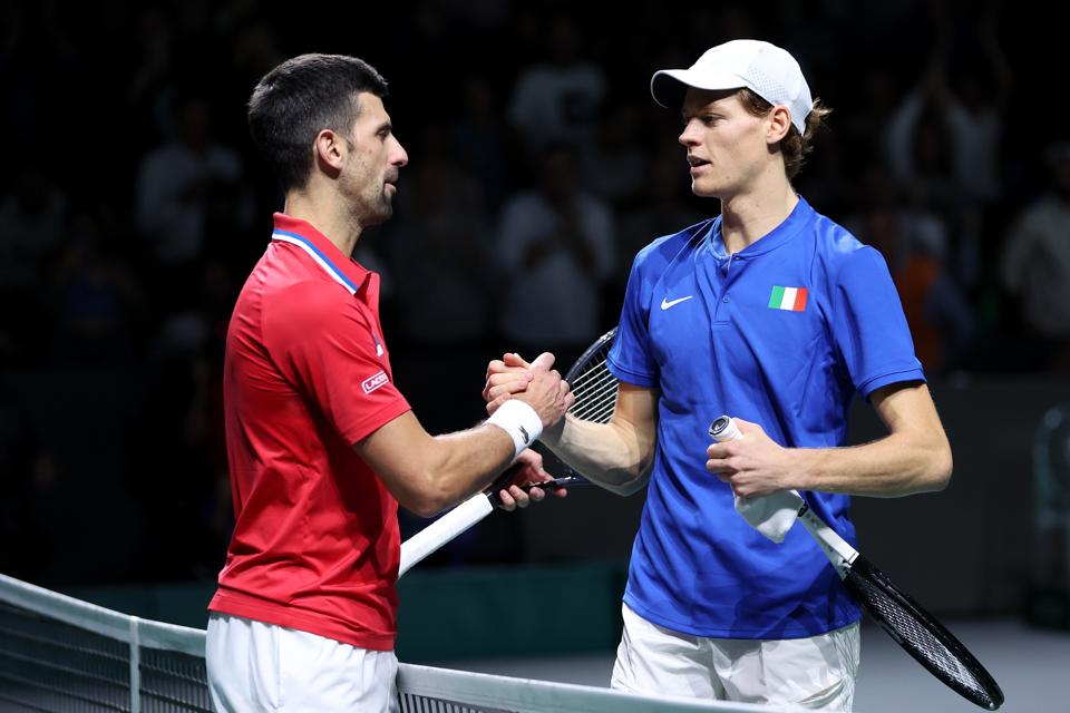 Jannik Sinner greets Novak Djokovic after beating him in the Davis Cup semi-final.