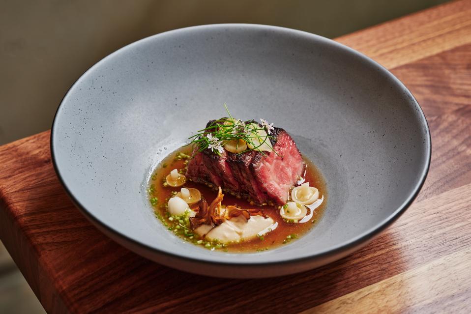Australian wagyu with oxtail dashi, kinoko mushrooms, garlic chive, and miso.
