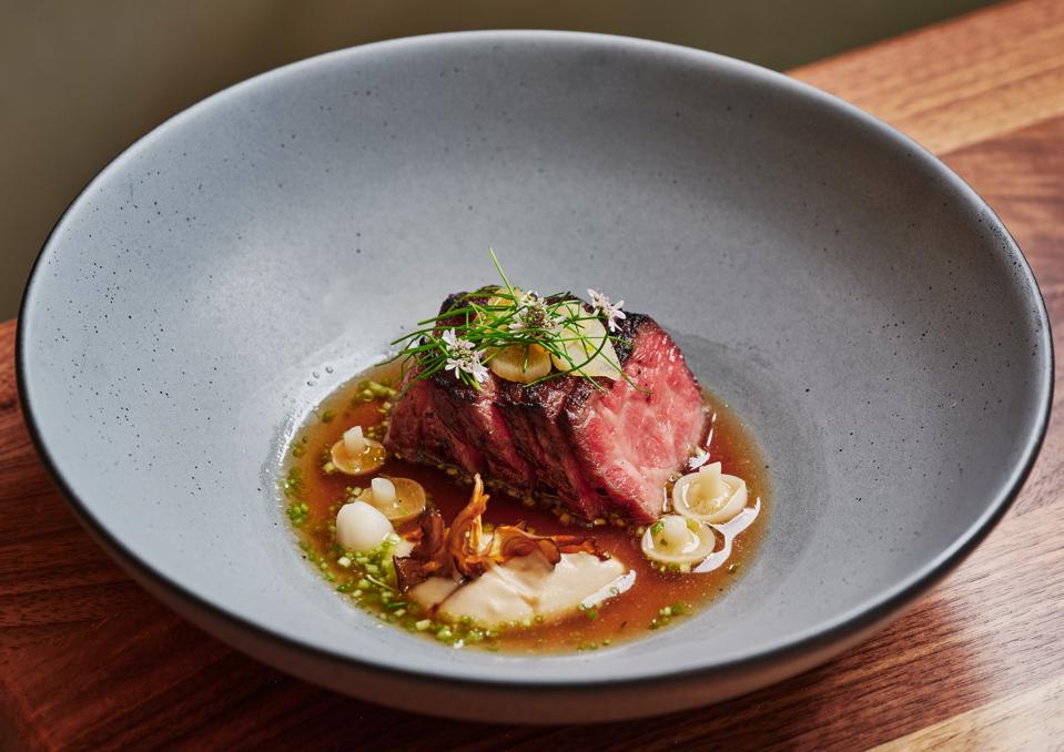Australian wagyu with oxtail dashi, kinoko mushrooms, garlic chive, and miso.