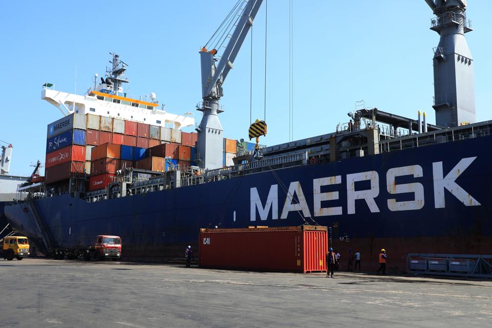 A view of a ship with containers on top at Chittagong Port.