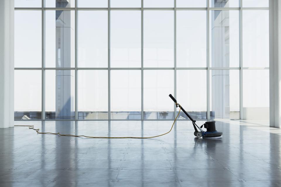 floor buffing machine in large empty office space