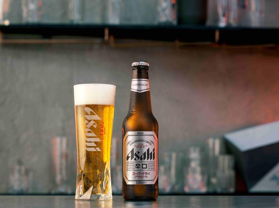 A glass and bottle of Asahi Super Dry