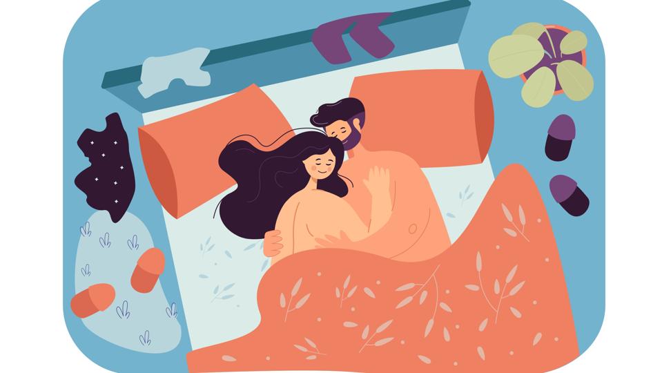 Loving couple lying in bed together