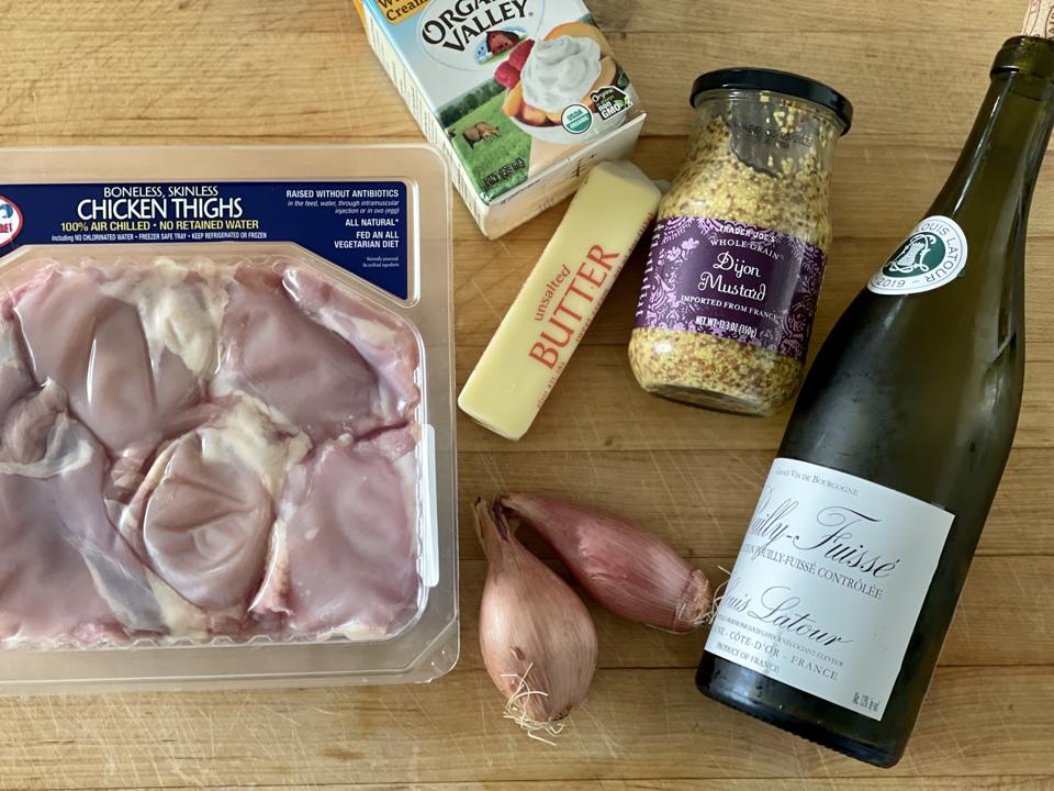 Six ingredients are all you need to make the perfect chicken dish that is quick and easy, and so good that you will make it again and again. In this photograph by Elizabeth Karmel are the six ingredients including boneless, skinless chicken thighs, heavy cream, unsalted butter, whole-grain Dijon mustard, shallots and white wine. The author also adds sautéed mushrooms to the dish which is optional.