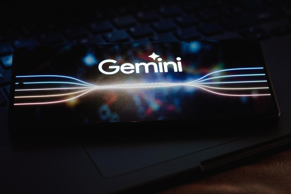 In this photo illustration, the Google Gemini logo is...