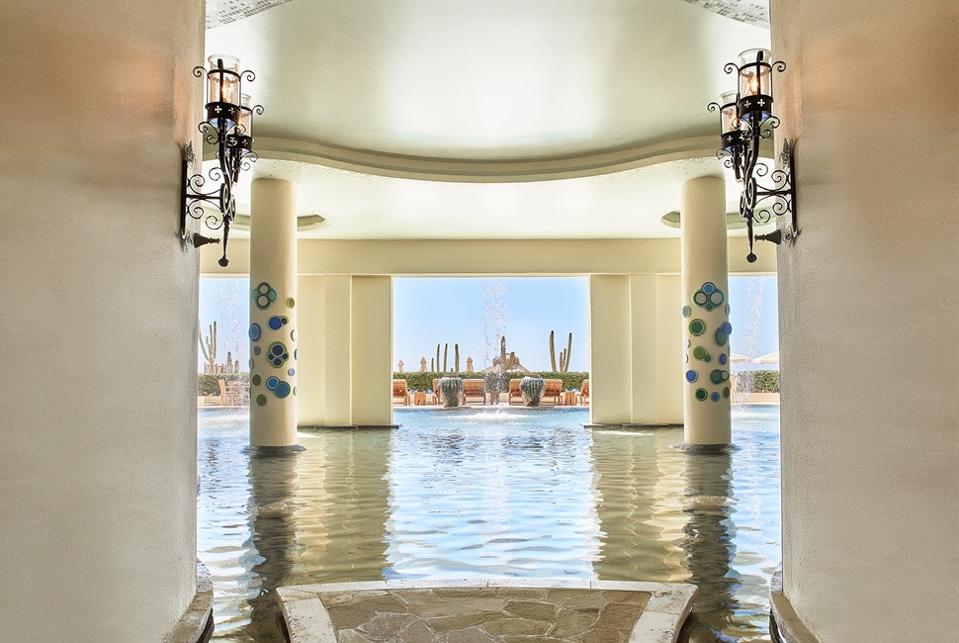 Treatment rooms open to a meditation pool.