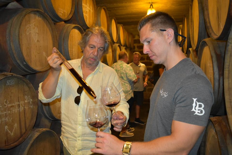 Collin Mitzenmacher, Cellar Master Waters Edge Winery Long Beach with winemaker Vahe Keushguerian taste wine from the barrel.