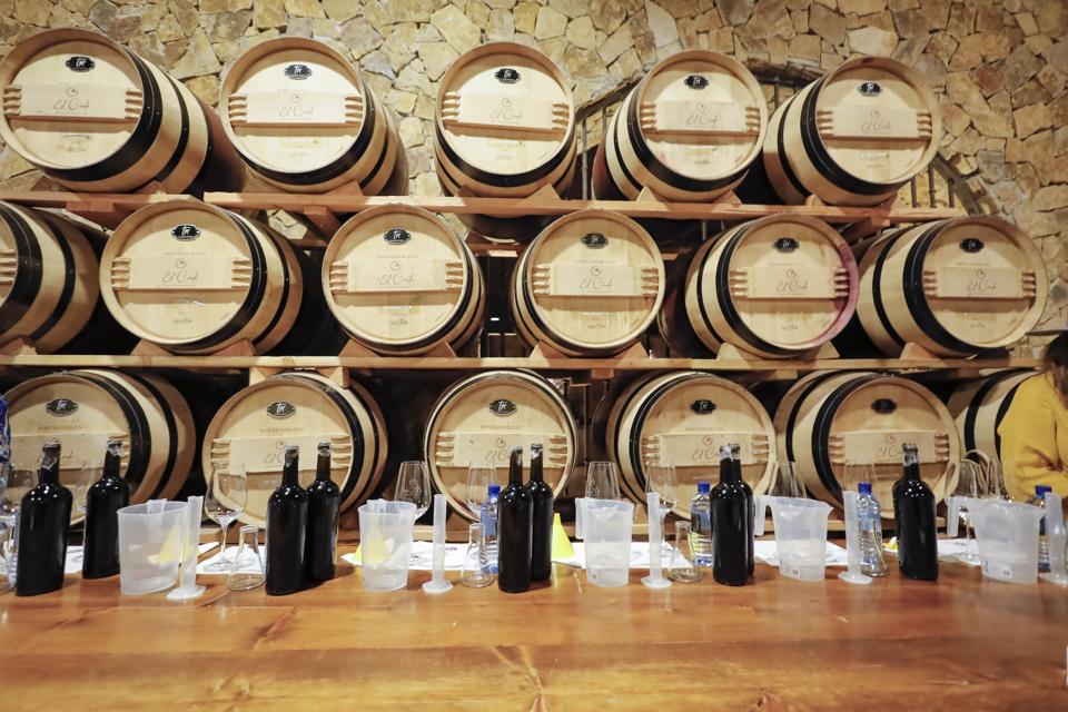 a wine cellar lined with wine barrels