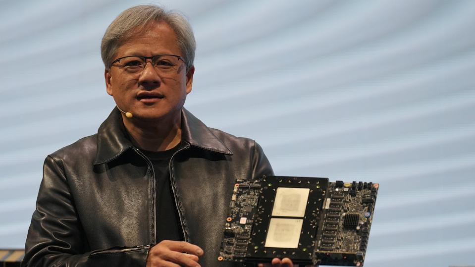 Jensen Huang, President of NVIDIA holding the Grace hopper...