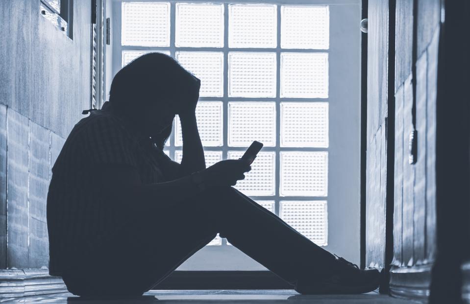 Depressed woman sitting alone