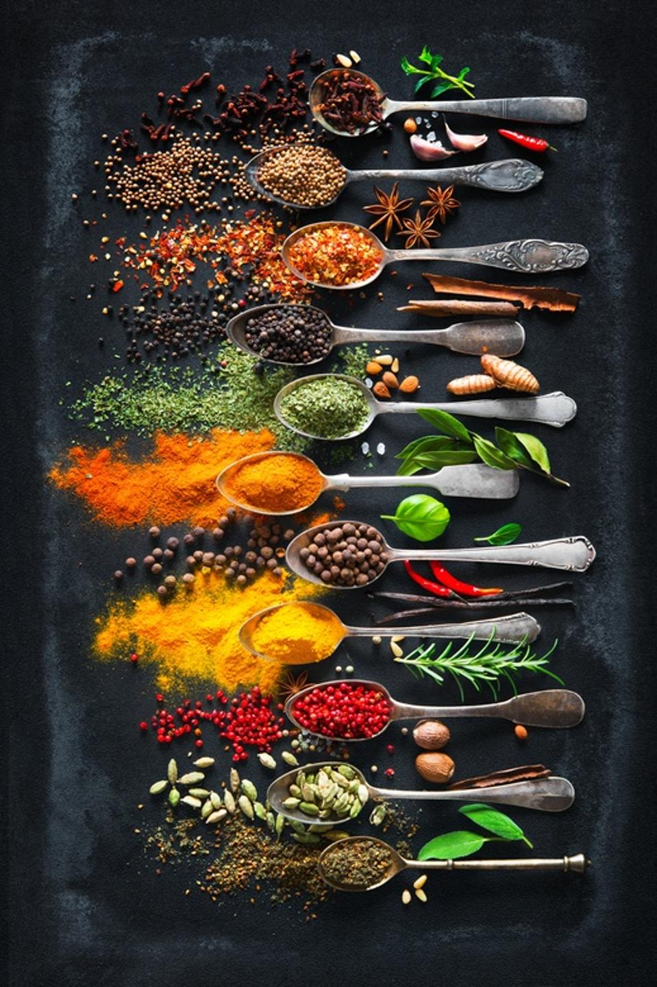 Herbs and spices for cooking on dark background