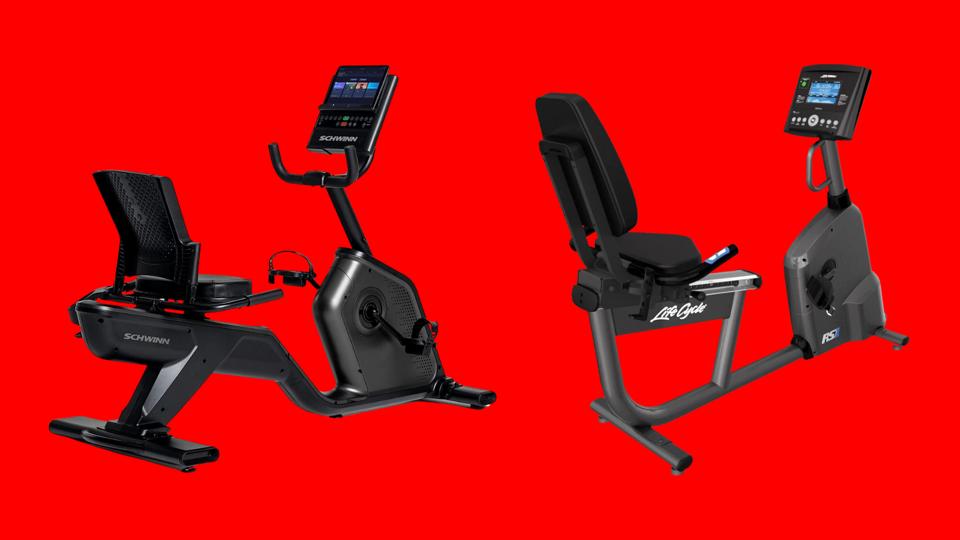 Two recumbent exercise bikes on a bright red background