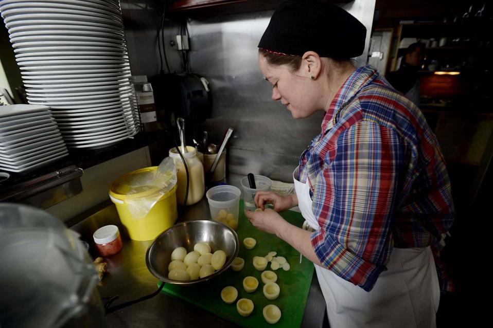 Sous chef Skye Bonney of The Black Birch makes high end deviled eggs Wednesday, March 20, 2013.