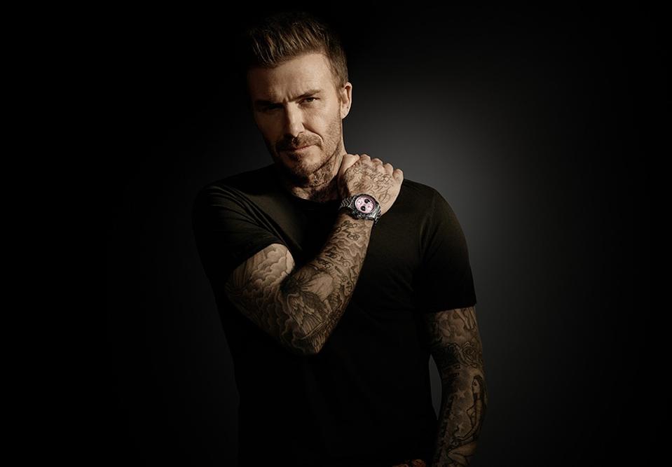 Tudor ambassador David Beckham models the new Black Bay Chrono in pink.