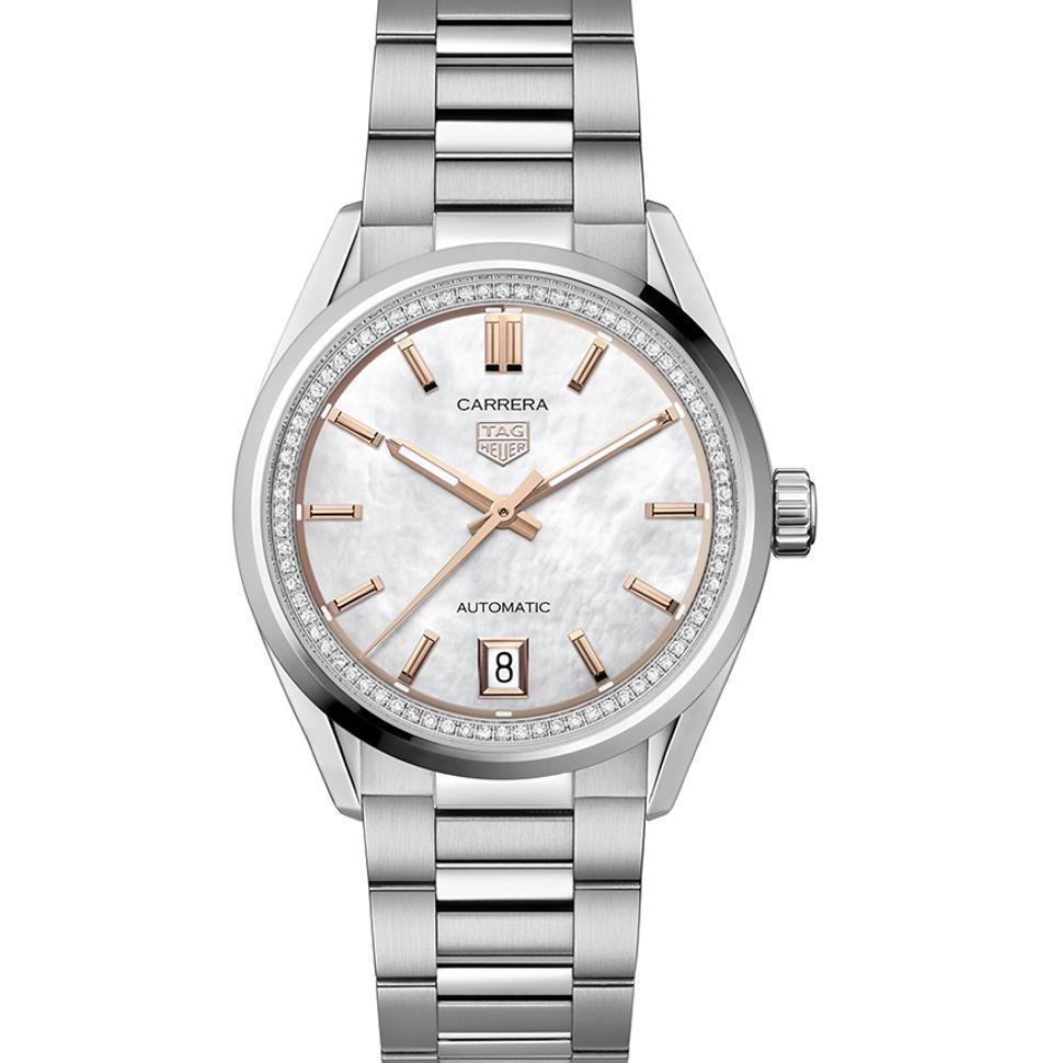 The steel TAG Heuer Carrera Date with gold plated markers and hands and a diamond flange.