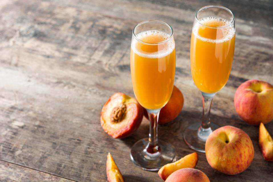 Bellini champagne cocktail in crystal glass
