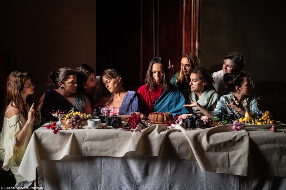 The scene of The Last Supper with women.