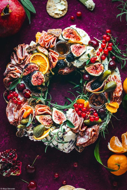 A wreath made of  different colors fruits.