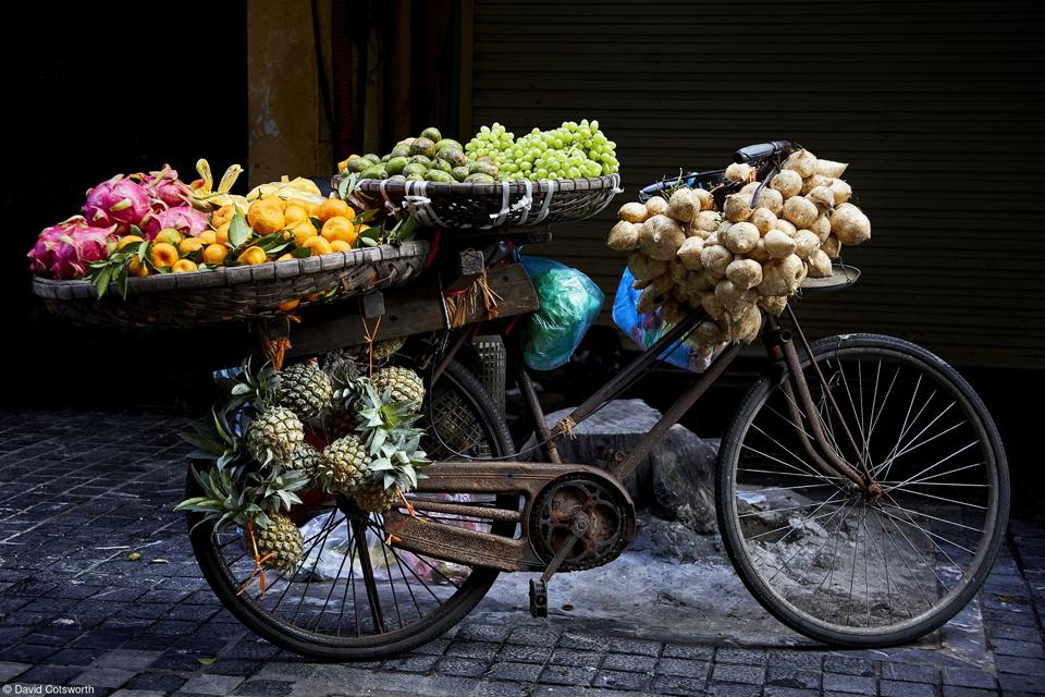 A bike carrying fruits and vegetables.