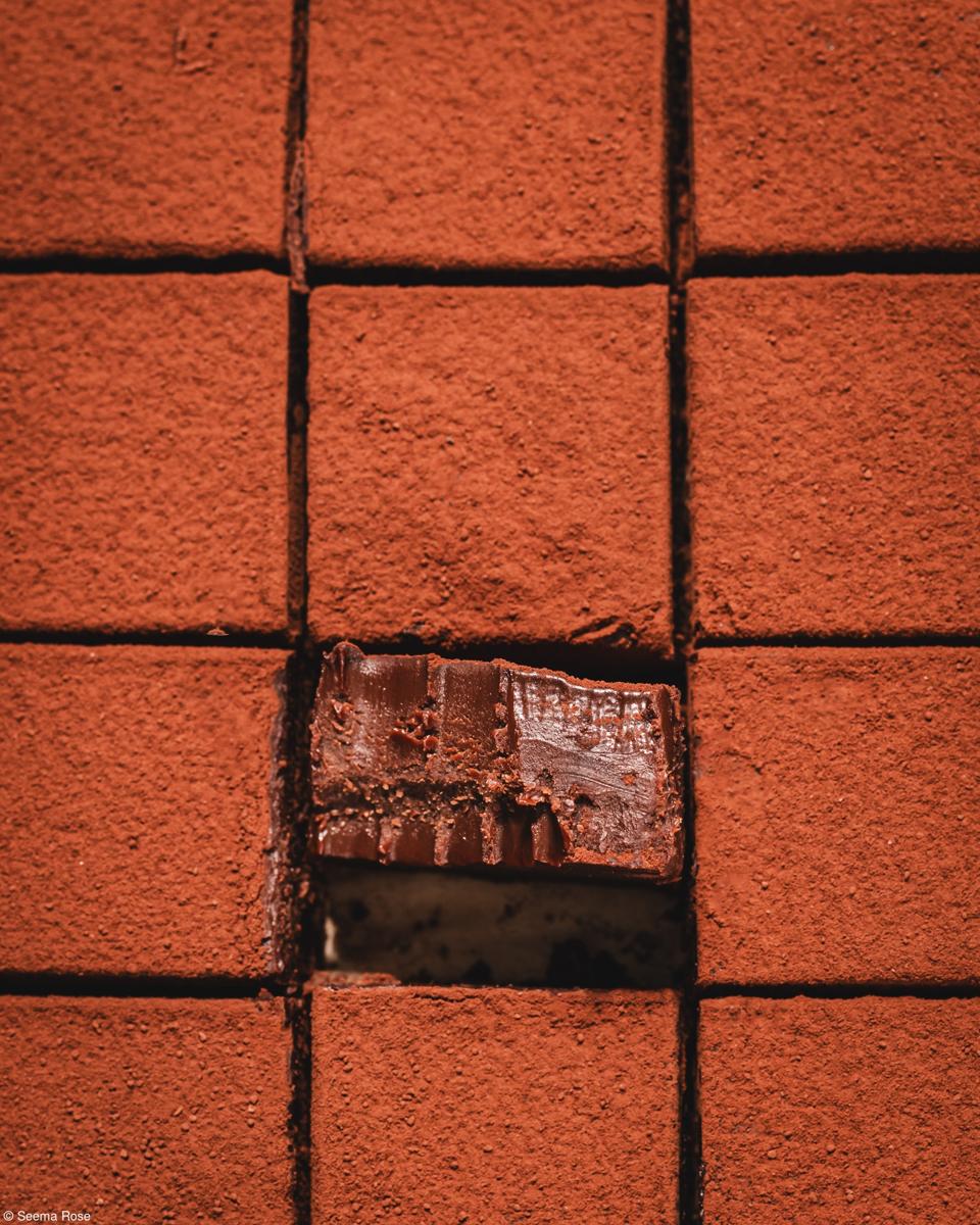 A chocolate cake cut in squares.