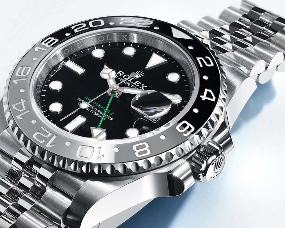 Rolex GMT-Master II with gray and black Cerachrom dial and Jubilee bracelet.