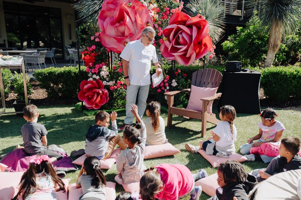 Chef Richard Sandoval talks to a group of children.