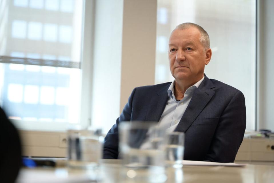 Igor Lah sits at a conference table. He wears a dark blazer.