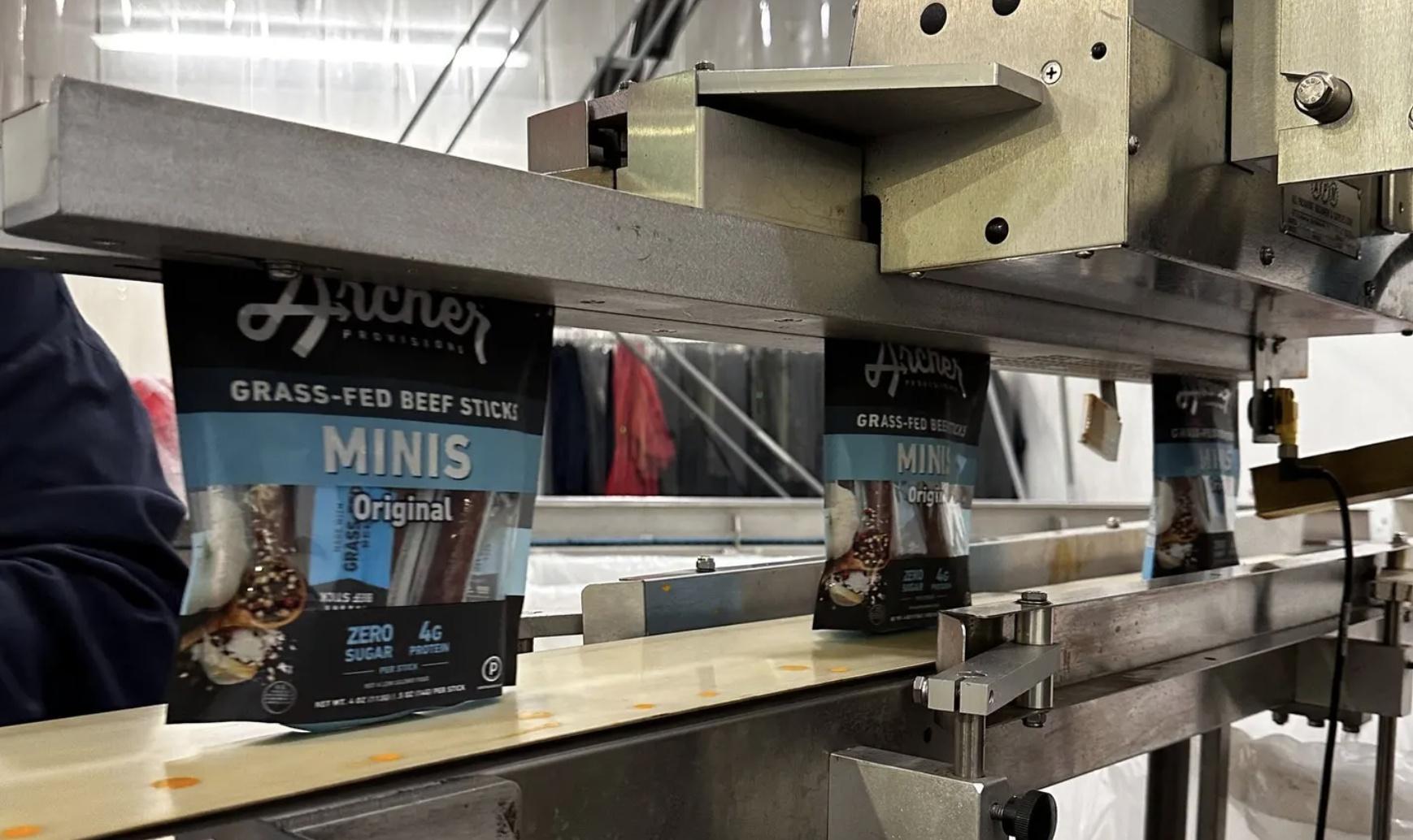 Country Archer jerky products being packaged on a factory line.