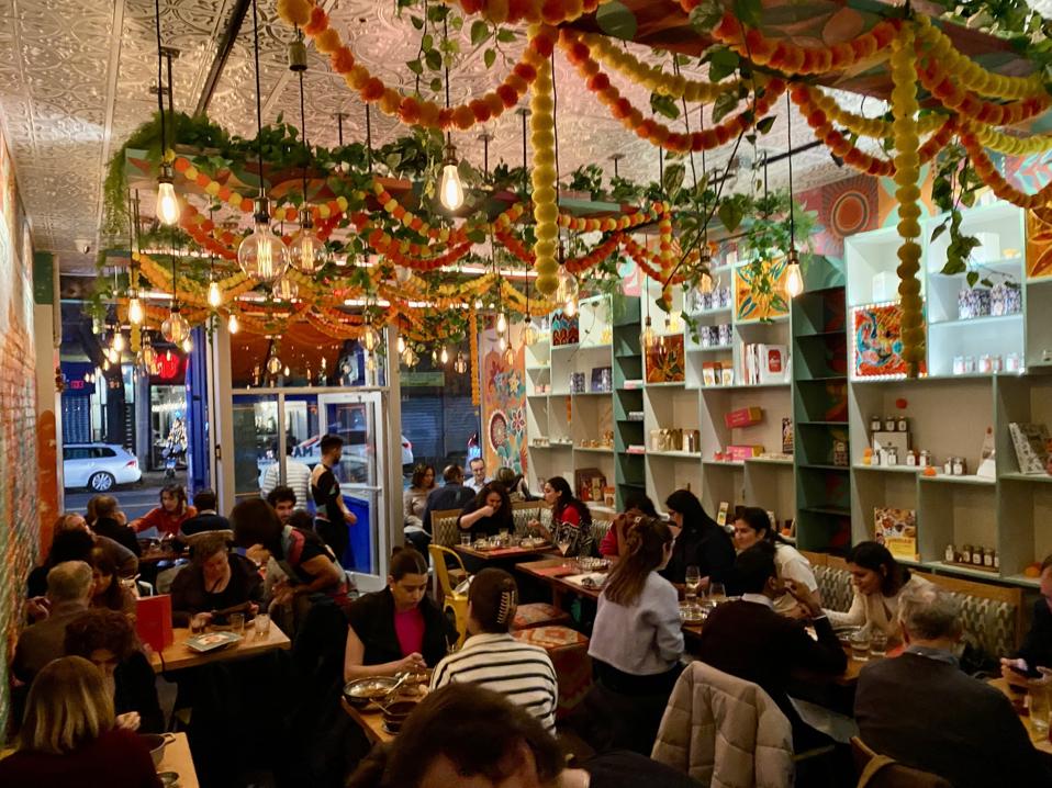 A crowded interior of the restaurant Masalawala & Sons in Brooklyn