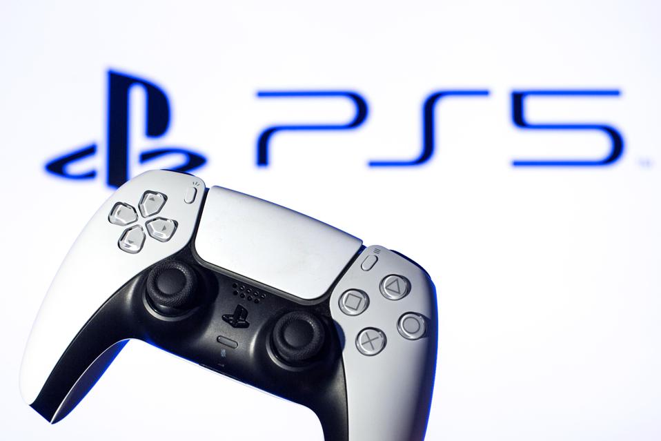In this photo illustration, a PlayStation 5 controller seen...