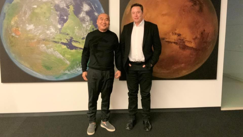 Leo Koguan, left, and Tesla CEO Elon Musk at SpaceX