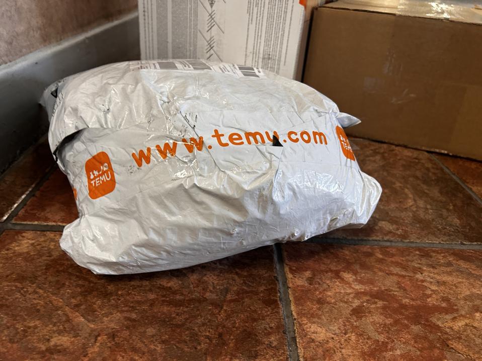 Temu package in apartment building lobby, Temu, which is owned by Chinese parent company PDD Holdings, shopping app Temu.com, Queens, New York
