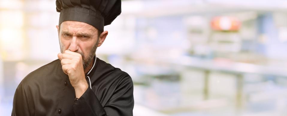 Senior cook man, wearing chef hat sick and coughing, suffering asthma or bronchitis, medicine concept