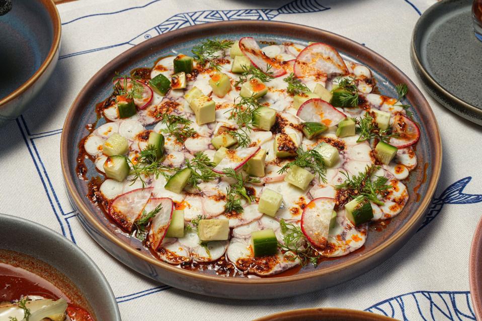 a plate of octopus carpaccio