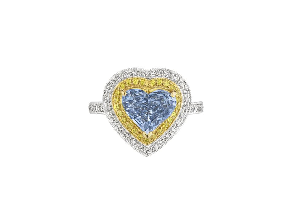 2.28-carat fancy vivid blue diamond, with yellow and white diamonds fetched $2.1 million