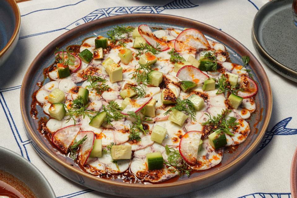 a plate of octopus carpaccio