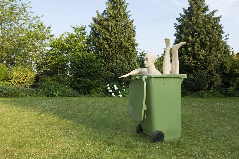 Mannequin in a wheelie bin