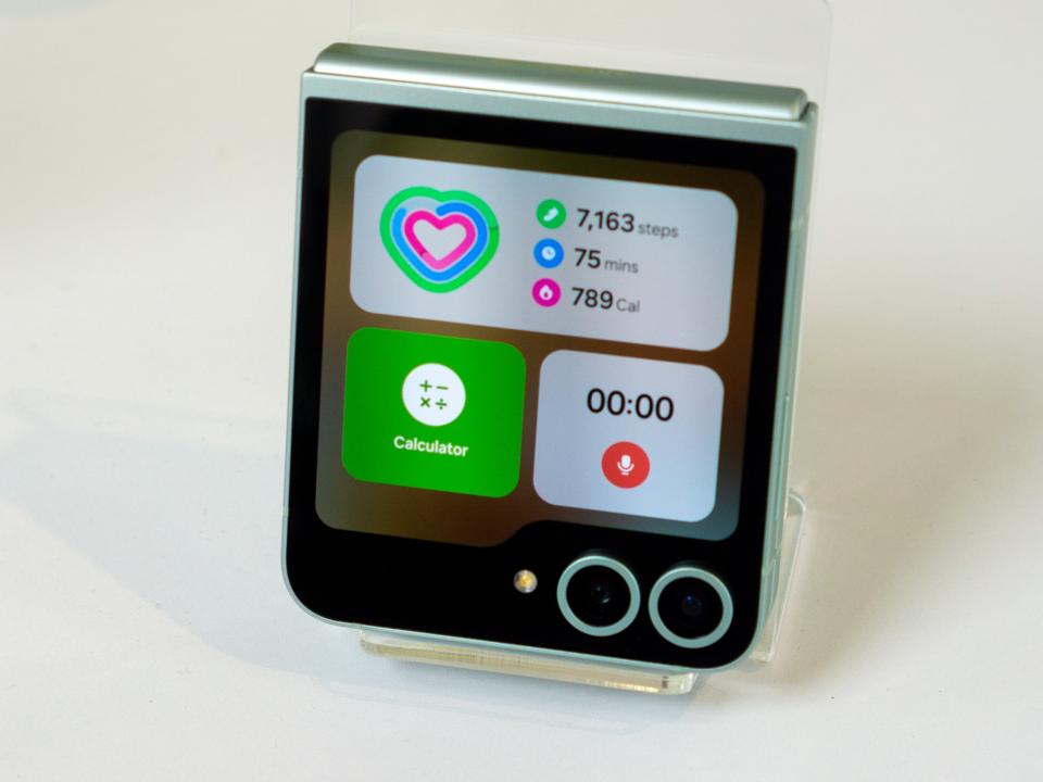 The Samsung Galaxy Z Flip 6 on a white table.