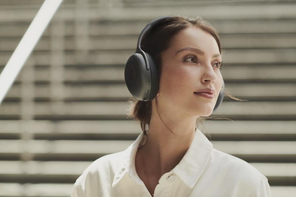 Woman wearing KEF Mu7 Charcoal Grey=