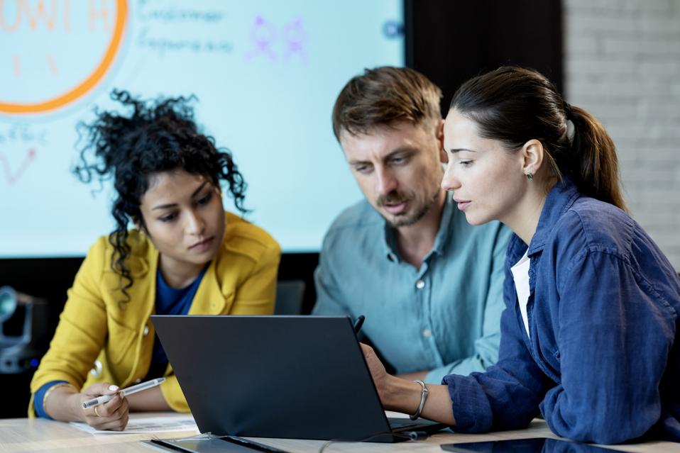 Market Research Can Help to Identify Opportunities and Customer Needs for Your Business Growth. Team of Products and business development is on a market trend data discuss over a laptop computer in a strategy meeting in a business office.