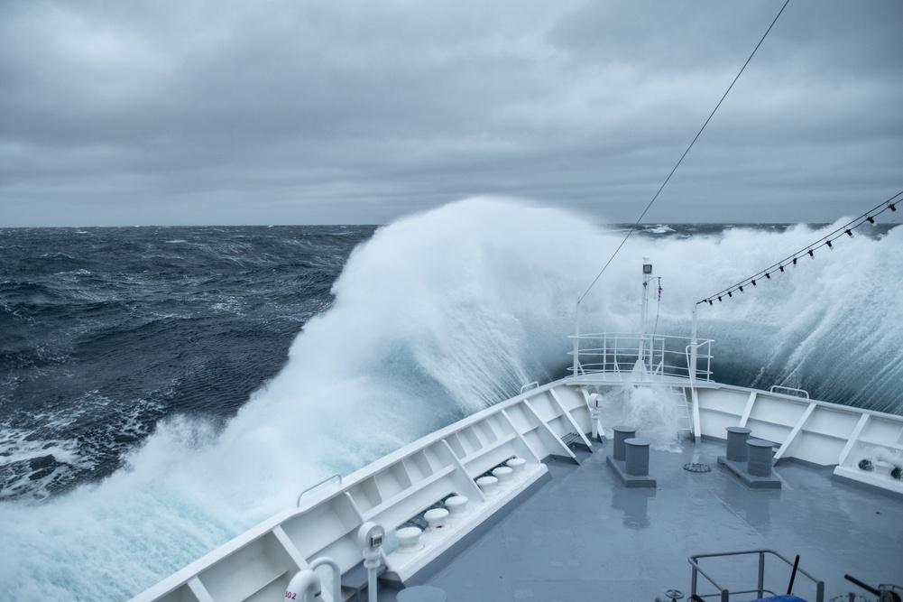 The bow of the expedition cruise ship MS Bremen (Hapag-Lloyd Cruises) in rough seas.