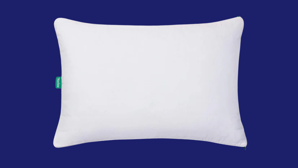 The Brooklinen Marlow Pillow against a blue background.