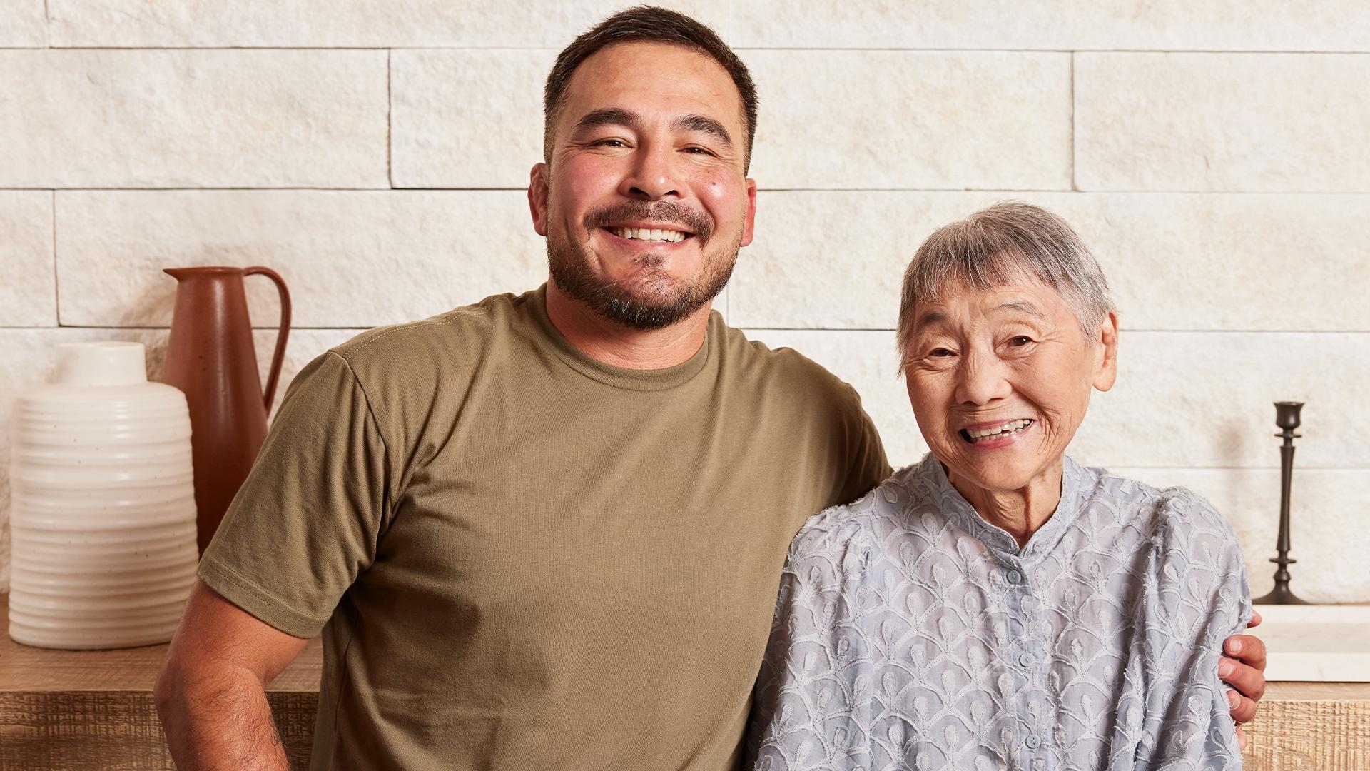 Bachan's barbecue sauce founder Justin Gill stands with his arm around his grandmother.