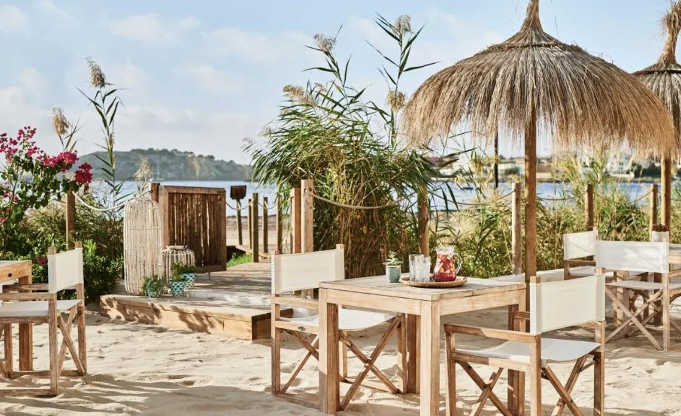 Tables are set on the beach at the Chambao restaurant at Nobu Hotel Ibiza Bay.