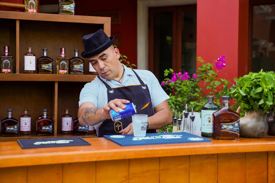 Joshia Monaghan making a cocktail