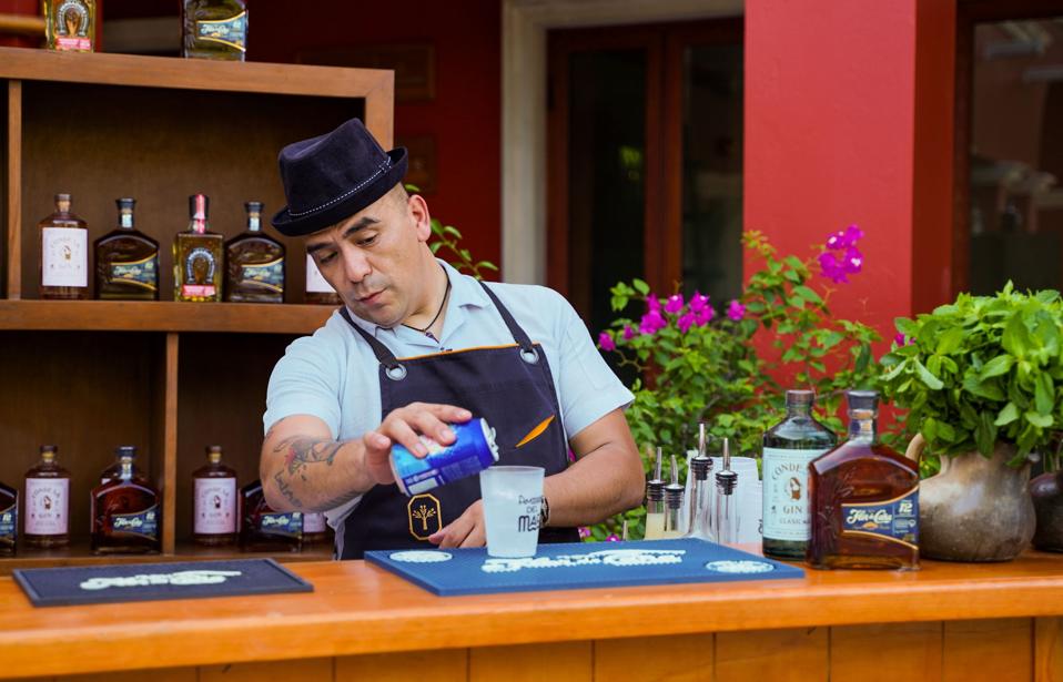 Joshia Monaghan making a cocktail