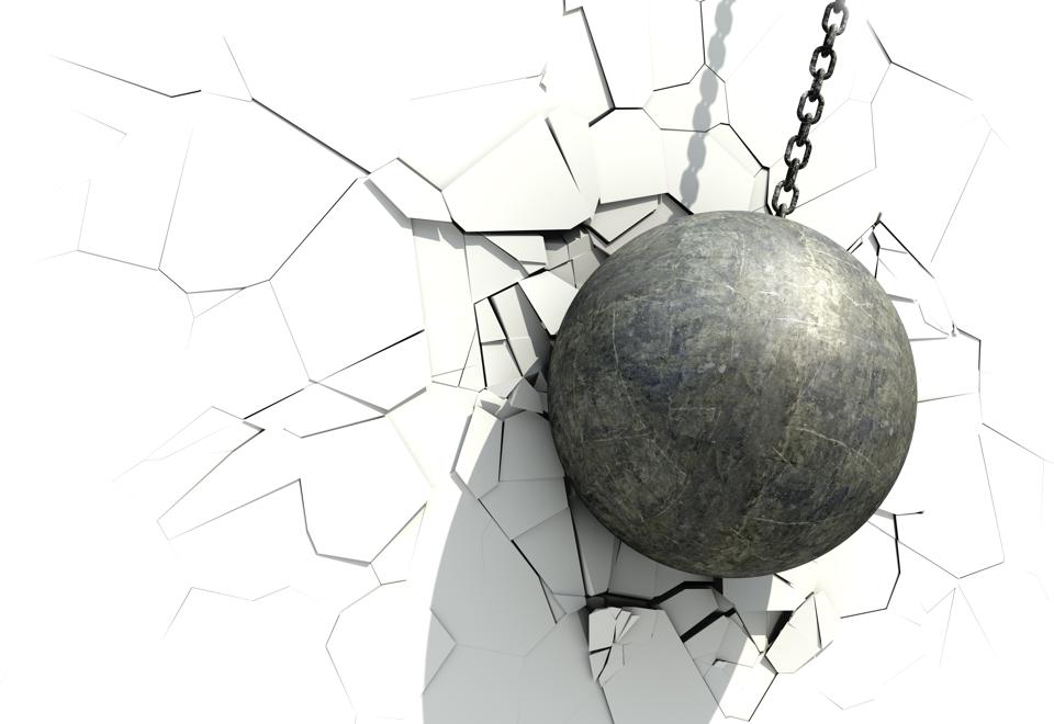 Metallic Wrecking Ball Shattering The White Wall