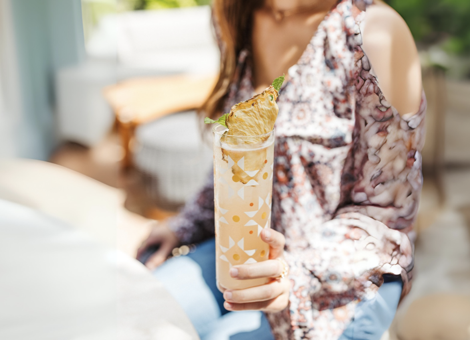 woman holding a cocktail glass