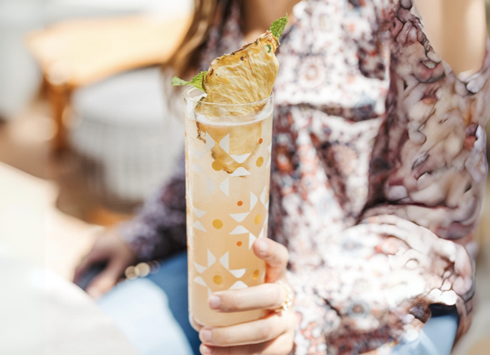 woman holding a cocktail glass