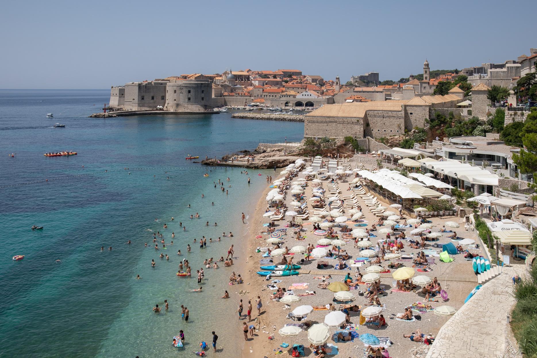 An aerial view of a crowded beach during the summer in Croatia.